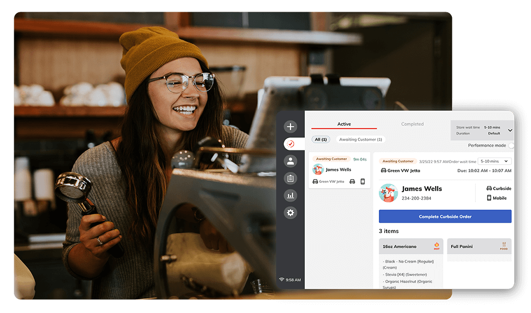 barista holding an espresso portafilter smiling at joe barista tablet sitting that displays a new joe mobile order barista holding an espresso portafilter smiling at joe barista tablet sitting that displays a new joe mobile order