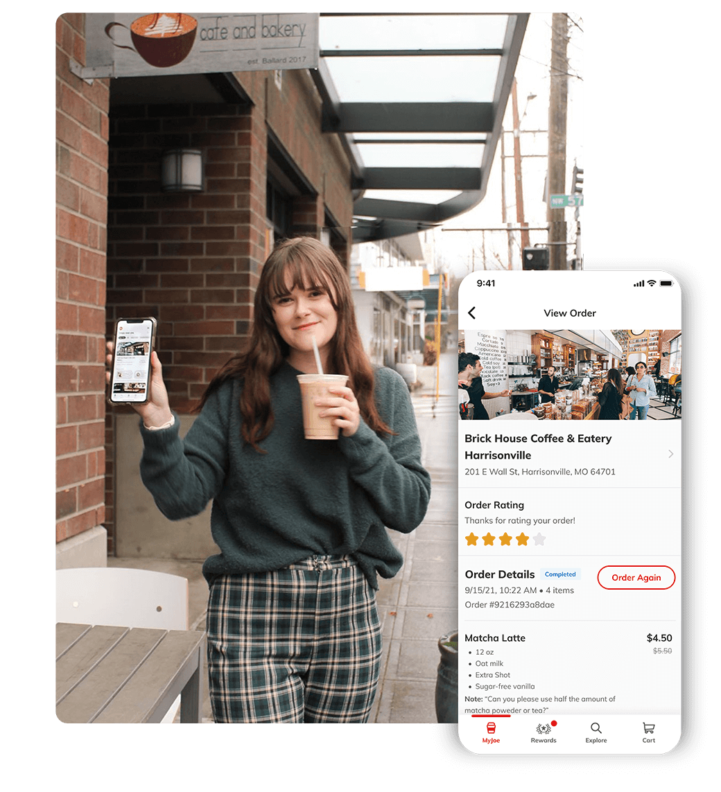 woman standing outside coffee shop sipping an iced latte while holding her iphone that displays the 