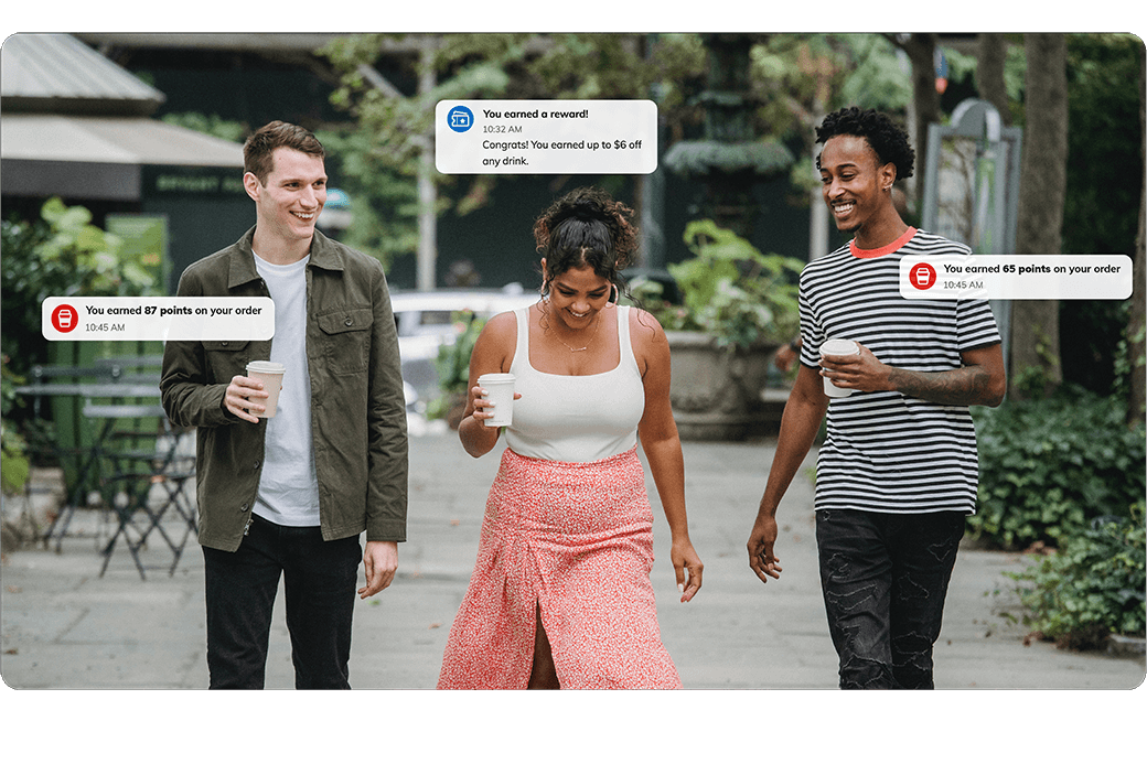 three coffee customers walking with life size notifications of their joe rewards hover above their heads